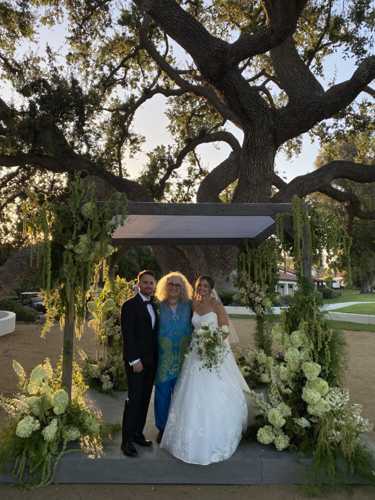 Wedding officiant Mitzi Schwarz with newly married couple
