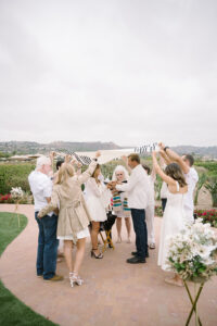 A non-Jewish family adapting the ritual of holding up the Chuppah during a Wedding Vow renewal ceremony