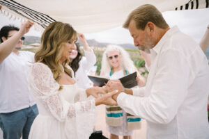 A Couple celebrating their 20th Wedding Anniversary by renewing their Wedding Vows and Exchanging New Wedding Rings with One Another. 
